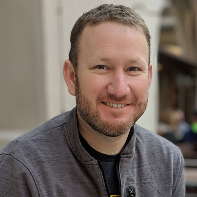 Headshot of Alex Patterson casual in Europe